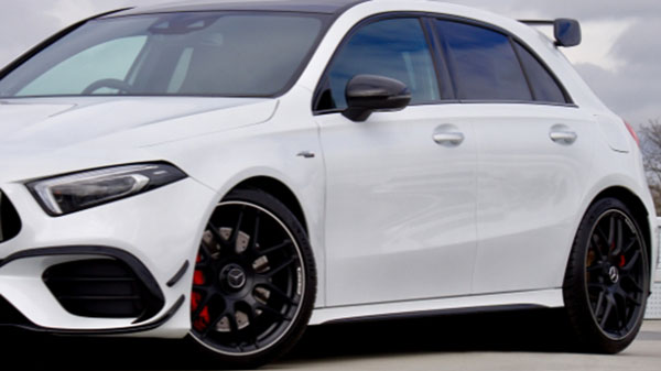 Outdoor image of a white sports car parked showing matching tyres on the front and rear which helps with overall performance and handling