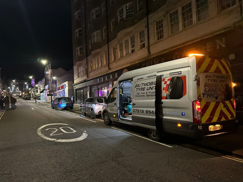 Fordlane mobile tyre fitting van parked in front of a residential area offering on-site tyre services.